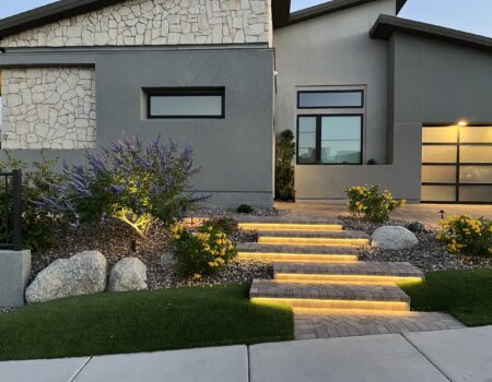 A house with steps leading to the front door.